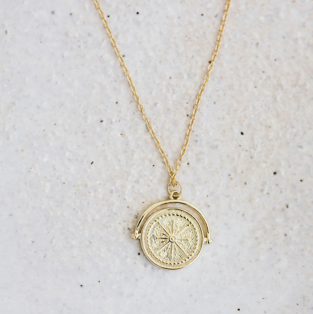 Golden compass necklace